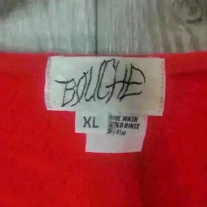 Vintage Bouche red sweater with jean pockets and rhinestone embellishments.